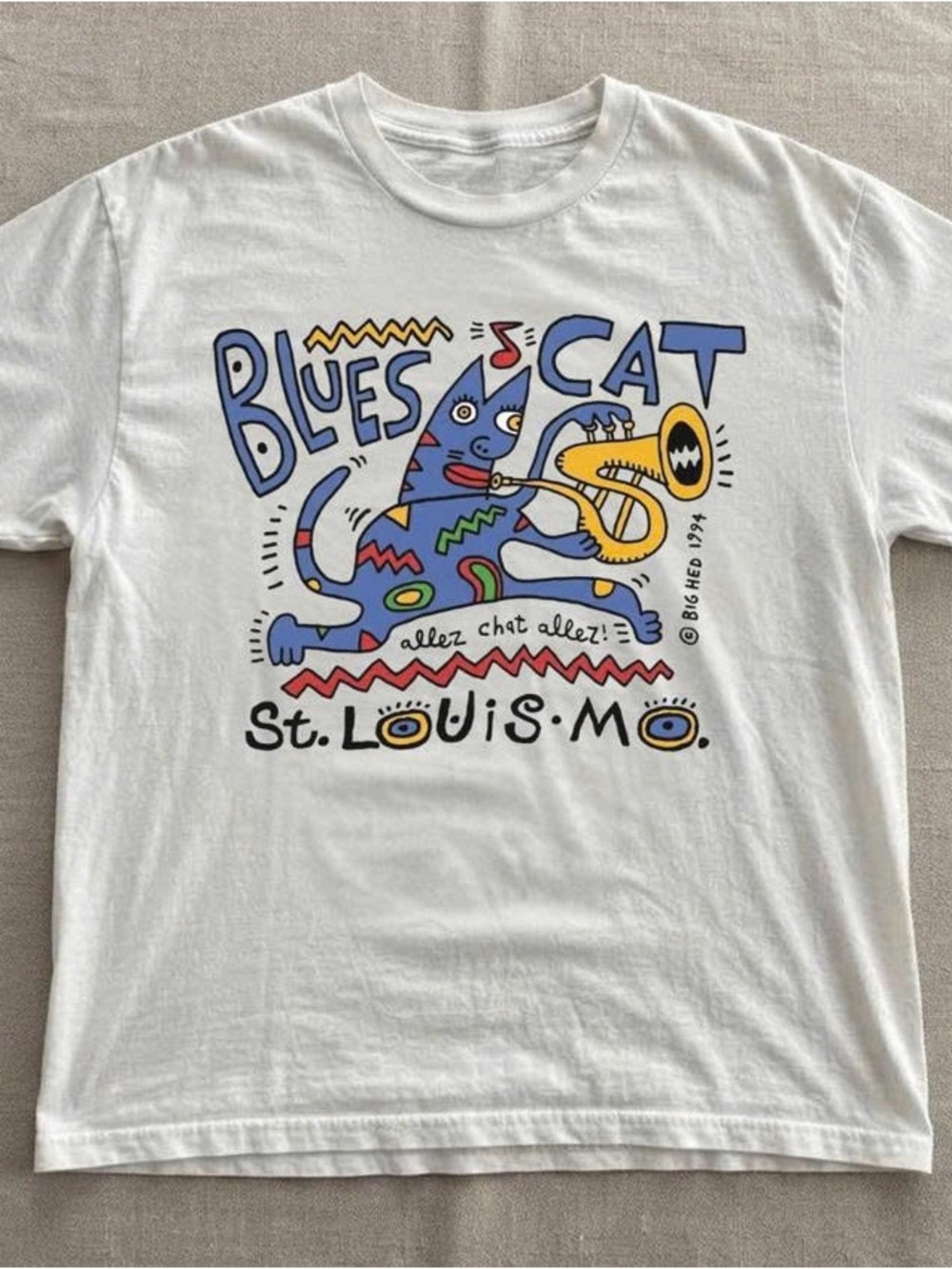 White Short-Sleeve Tee with Blue Cat & Yellow Trombone Graphic